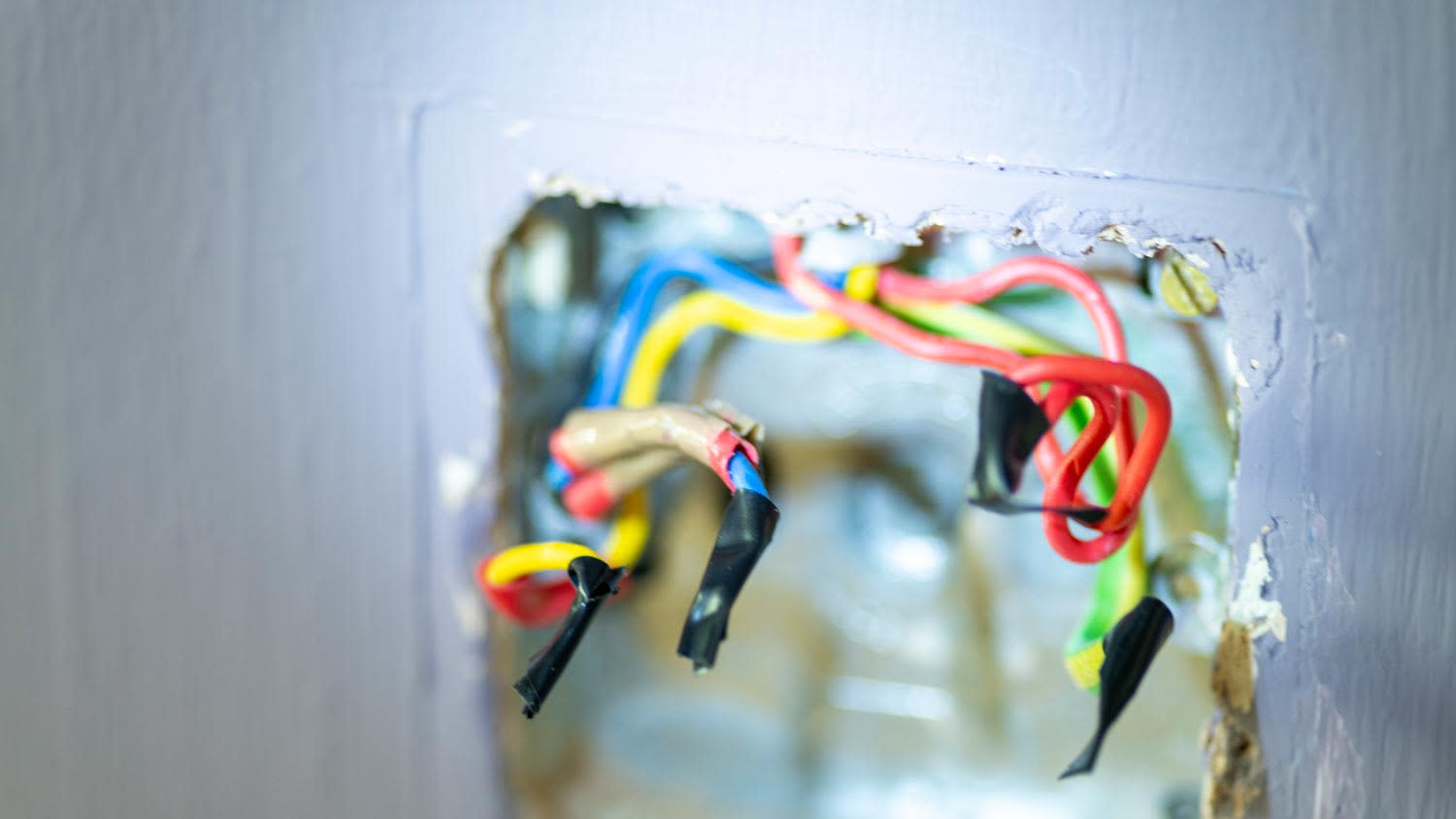 Exposed positive hot wires in wall