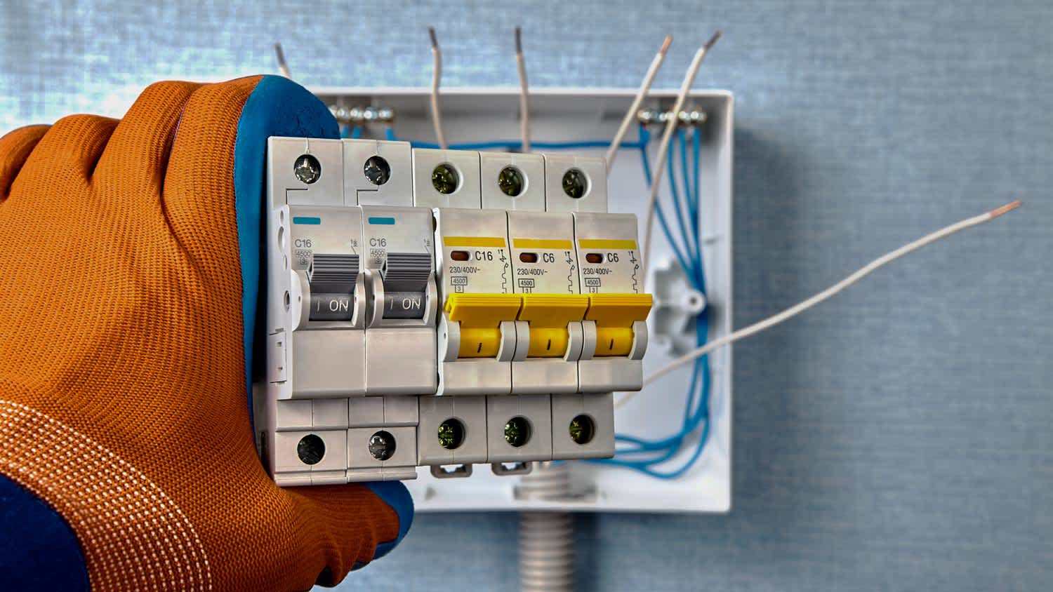 electrician holding fuse box