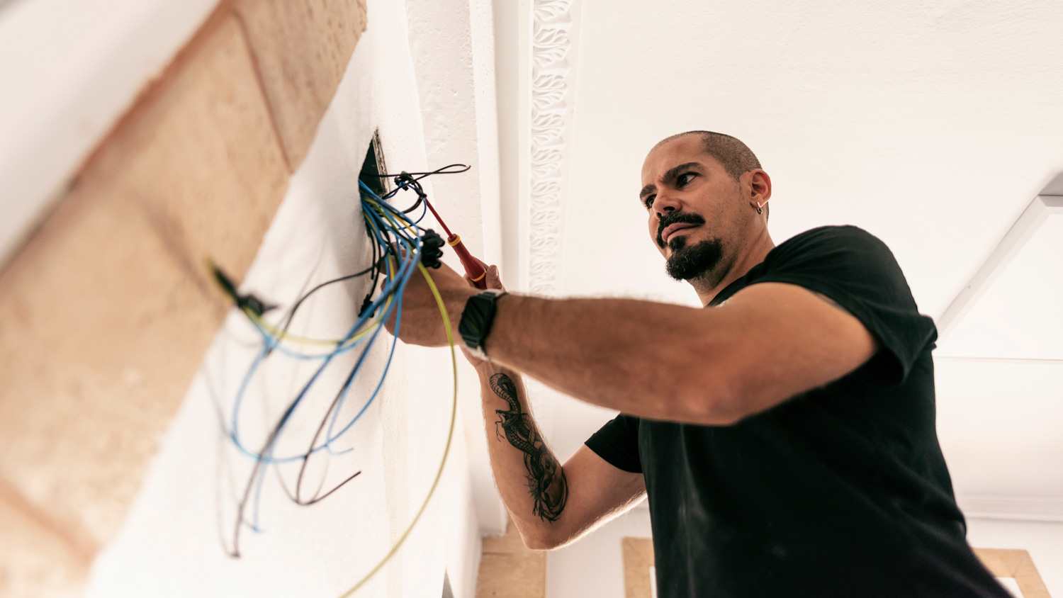 Electrician prepares the installation of electrical wiring