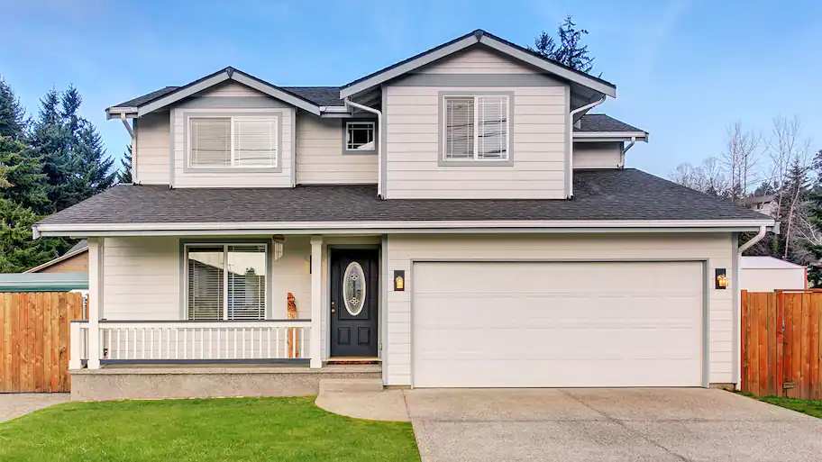 Biege home exterior with driveway
