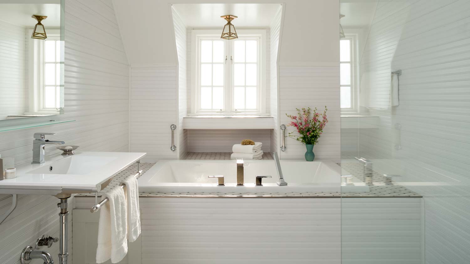 An all-white contemporary bathroom