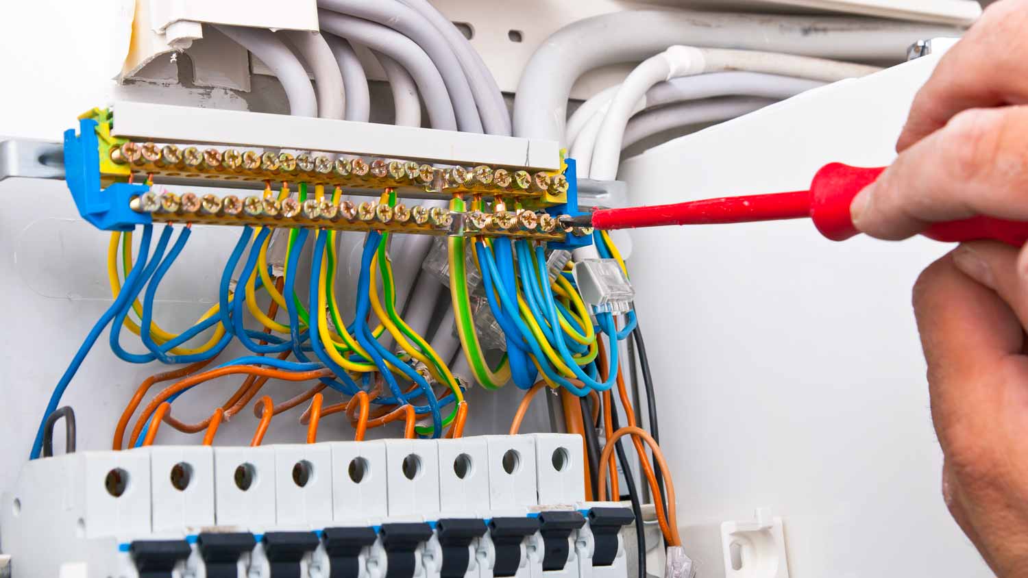 A person installing new electrical system