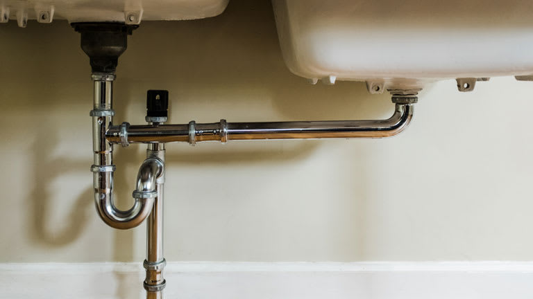 plumbing pipes under sink