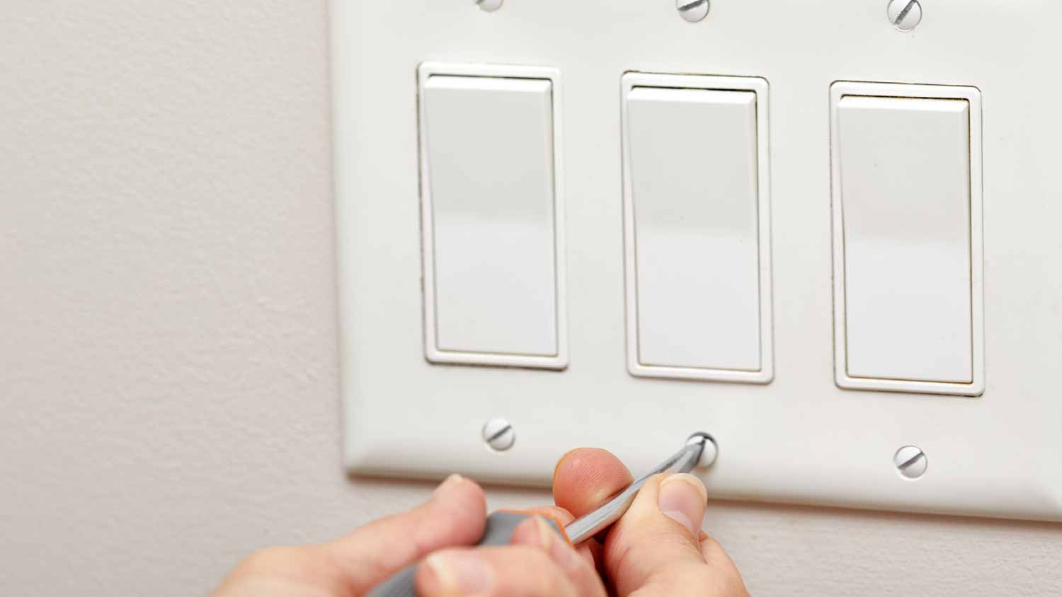 Electrician with screwdriver