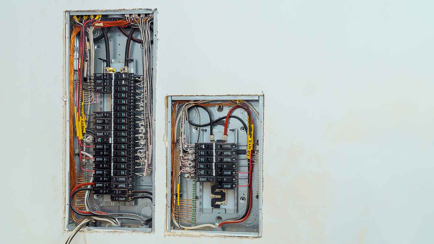 Subpanel installed next to a main electrical service panel