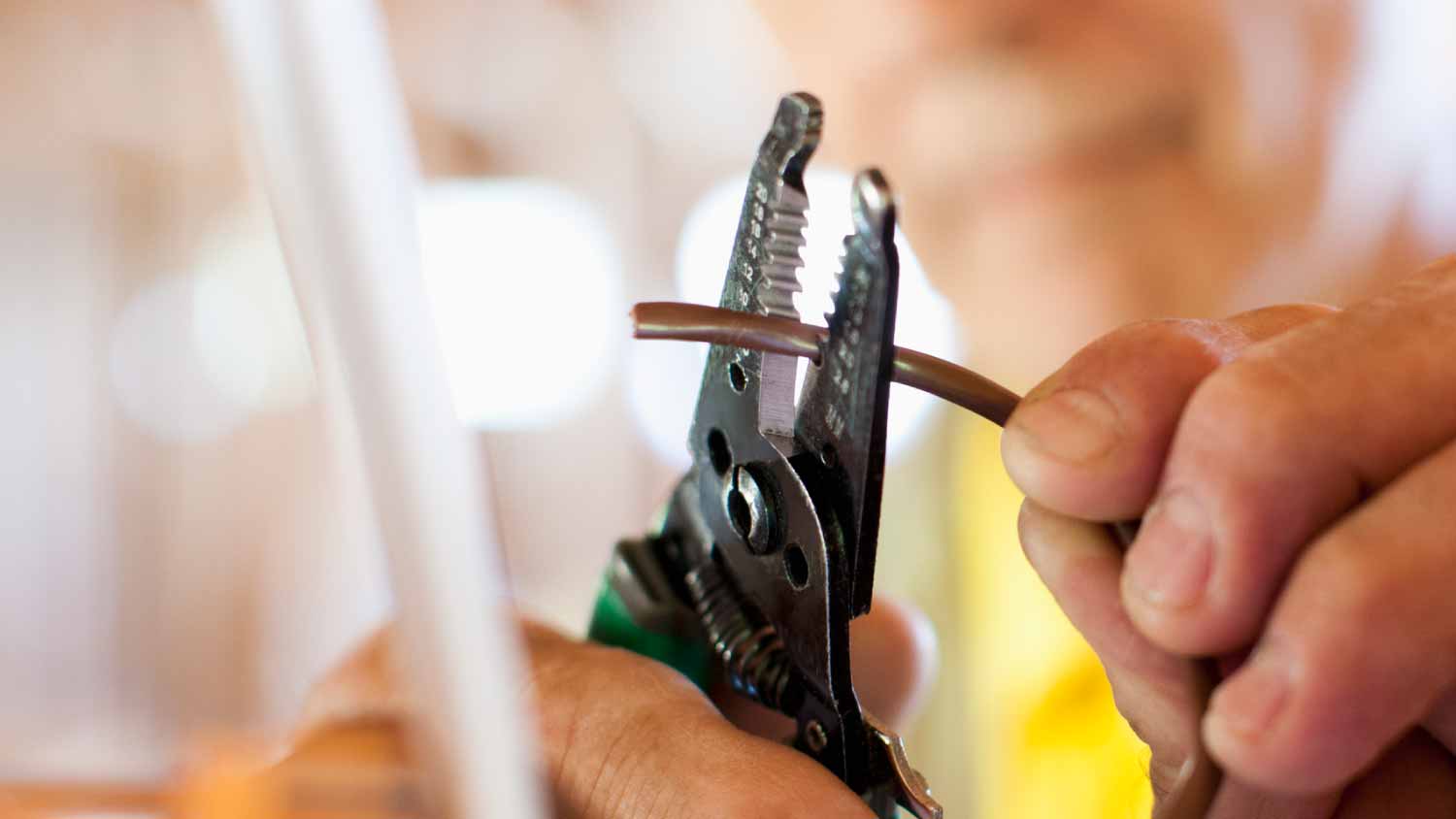 Man snipping wire
