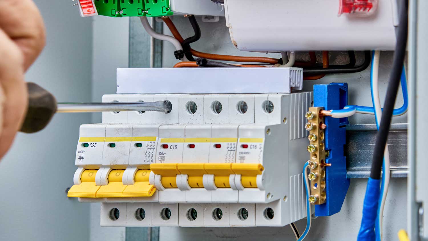 Removing a faulty circuit breaker with a screwdriver