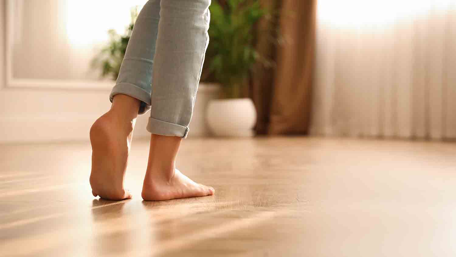 woman walking barefoot on house floor