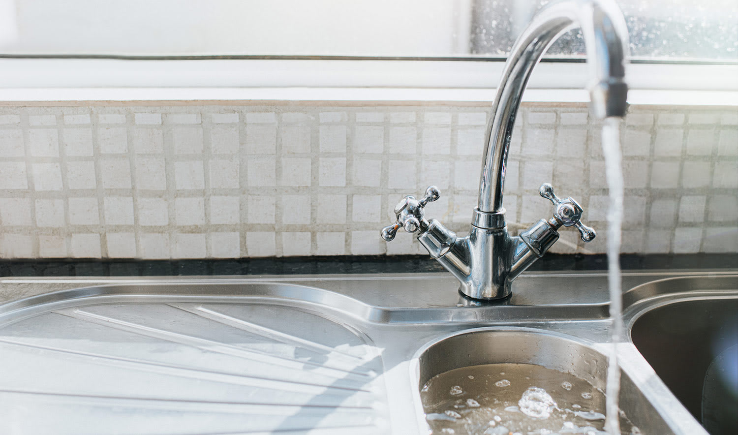 Sink with water running into it