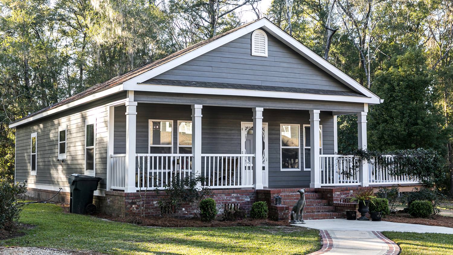 A beautiful home with blue gray fiber cement siding