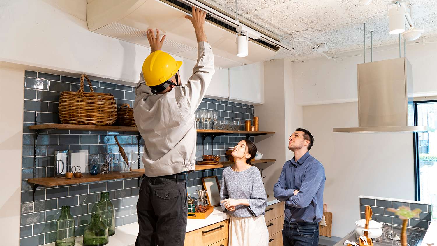repairman inspecting air conditioner