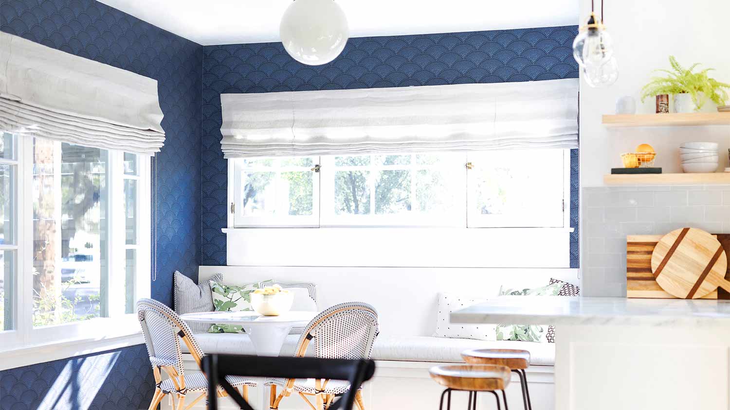 blue wallpaper in kitchen nook area