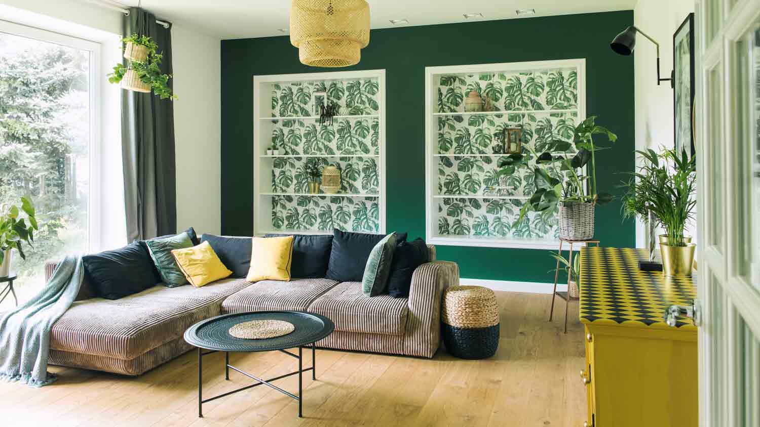 stylish apartment with green wall in living room