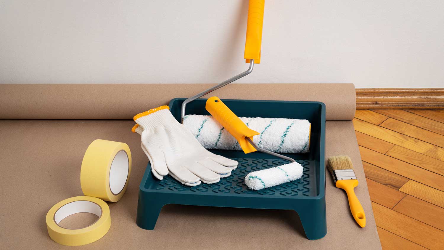 Painting tools placed on a wooden floor