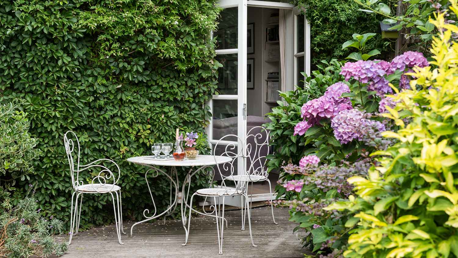 Terrace with metal table and chairs