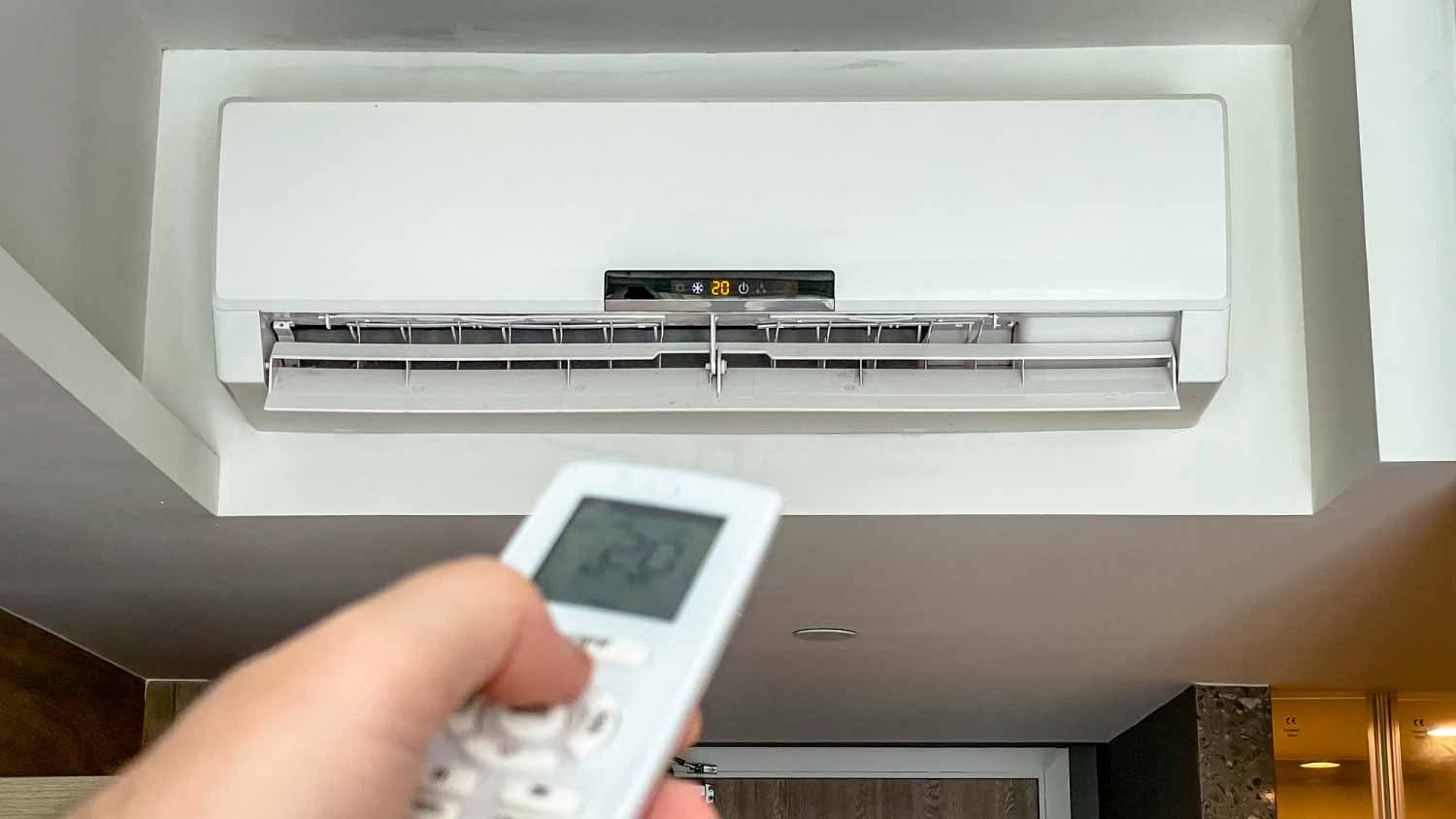 Man pointing at air conditioning unit