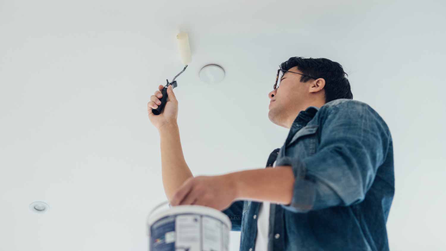 Man painting the ceiling