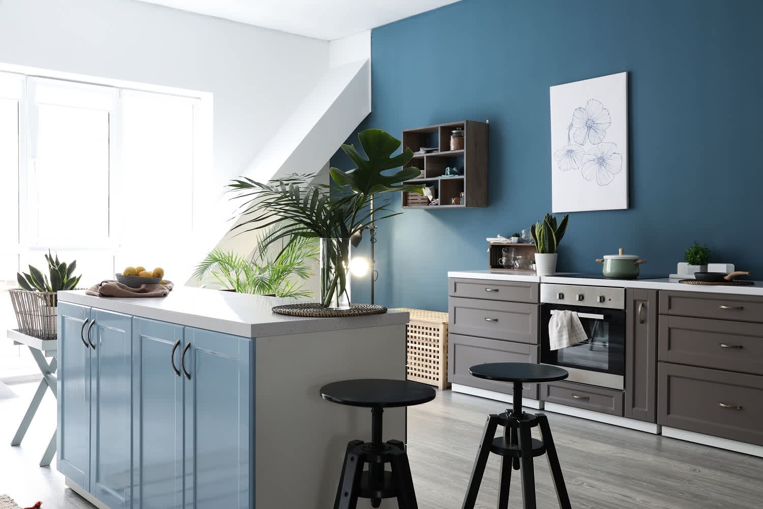 Interior of modern kitchen with blue walls