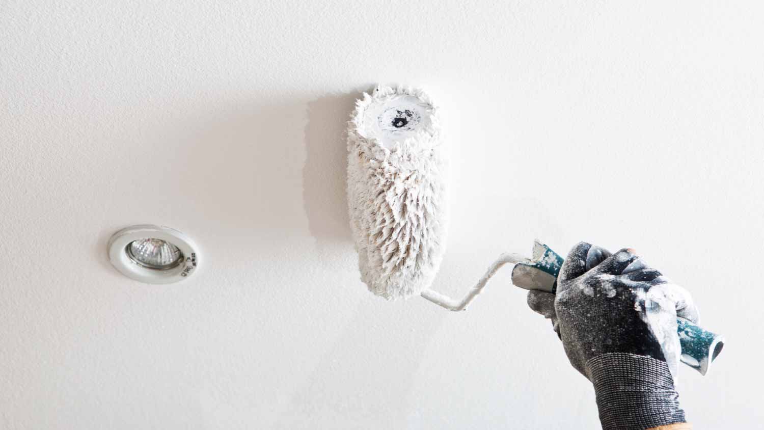 Painter painting a ceiling