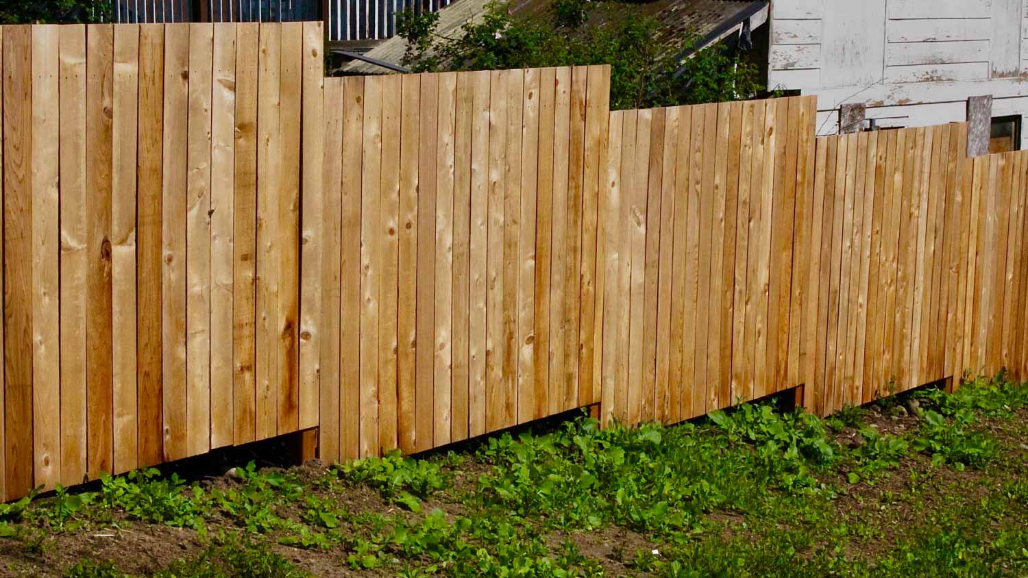 A new stair step wooden fence