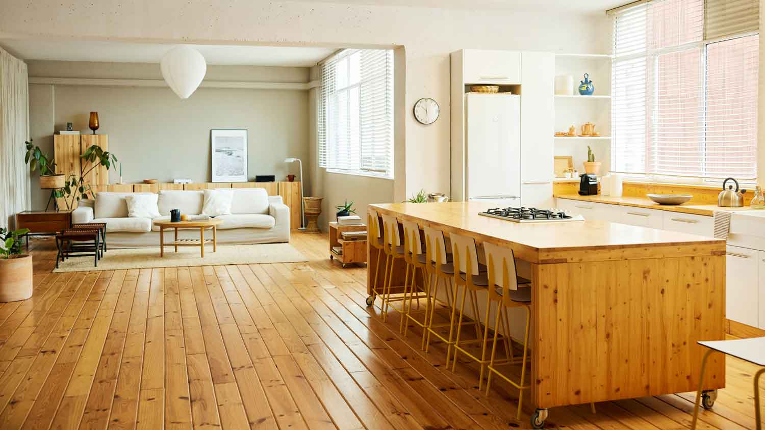 The interior of an open space living room and kitchen
