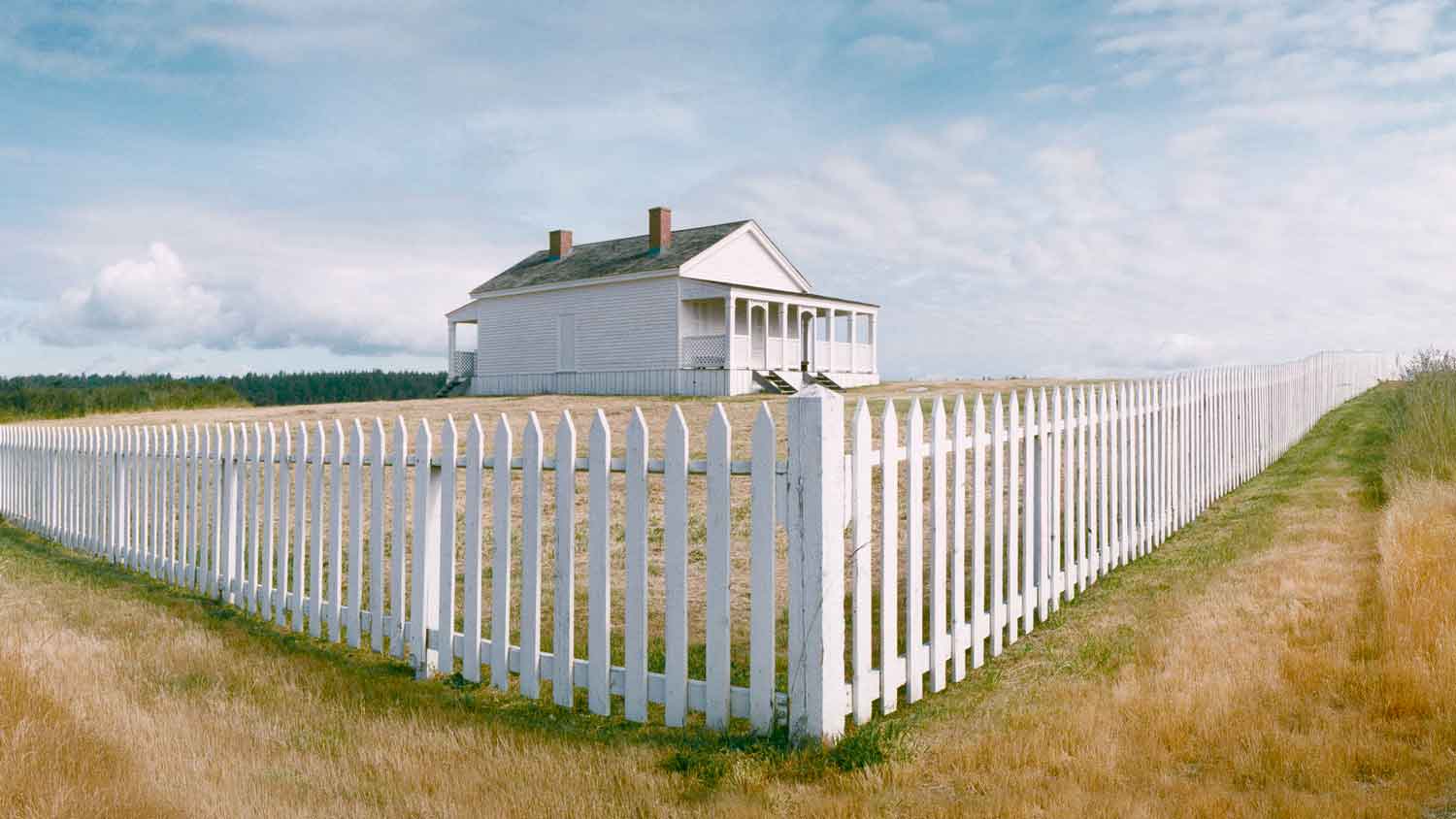 A house with a white picket fence