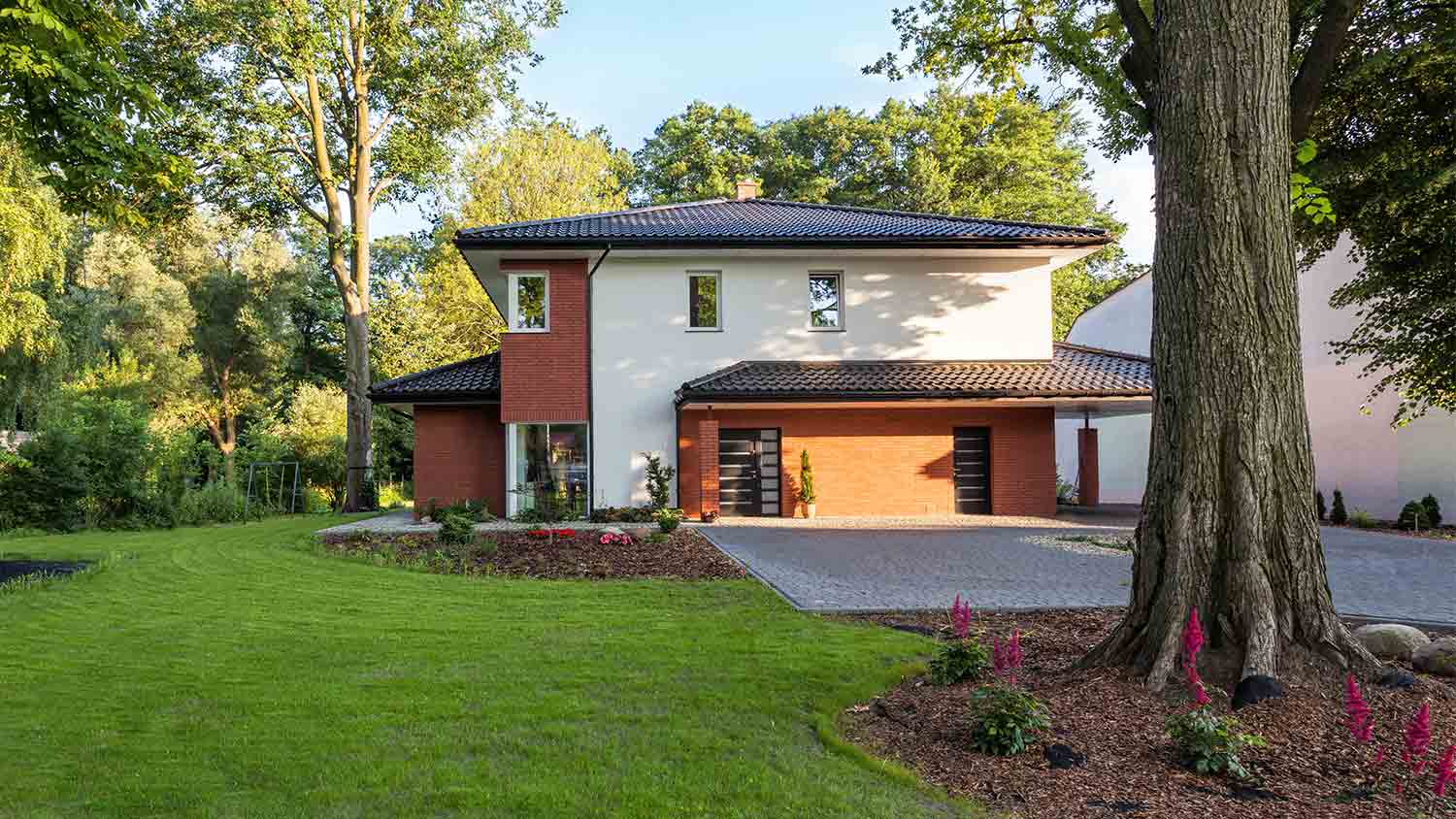 beautiful house with lush green lawn