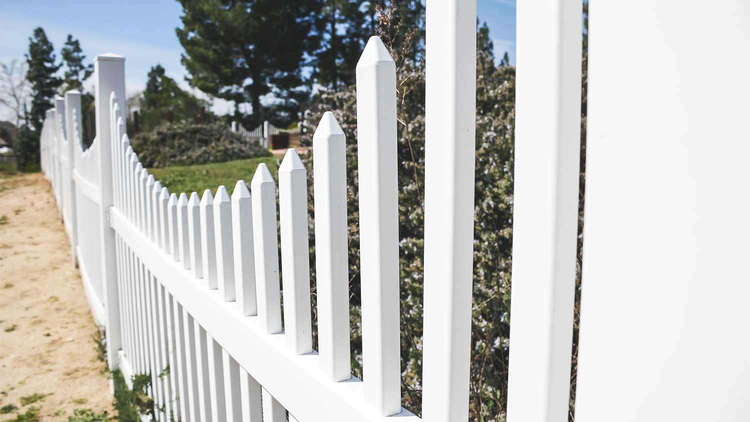 White picket fence in yard