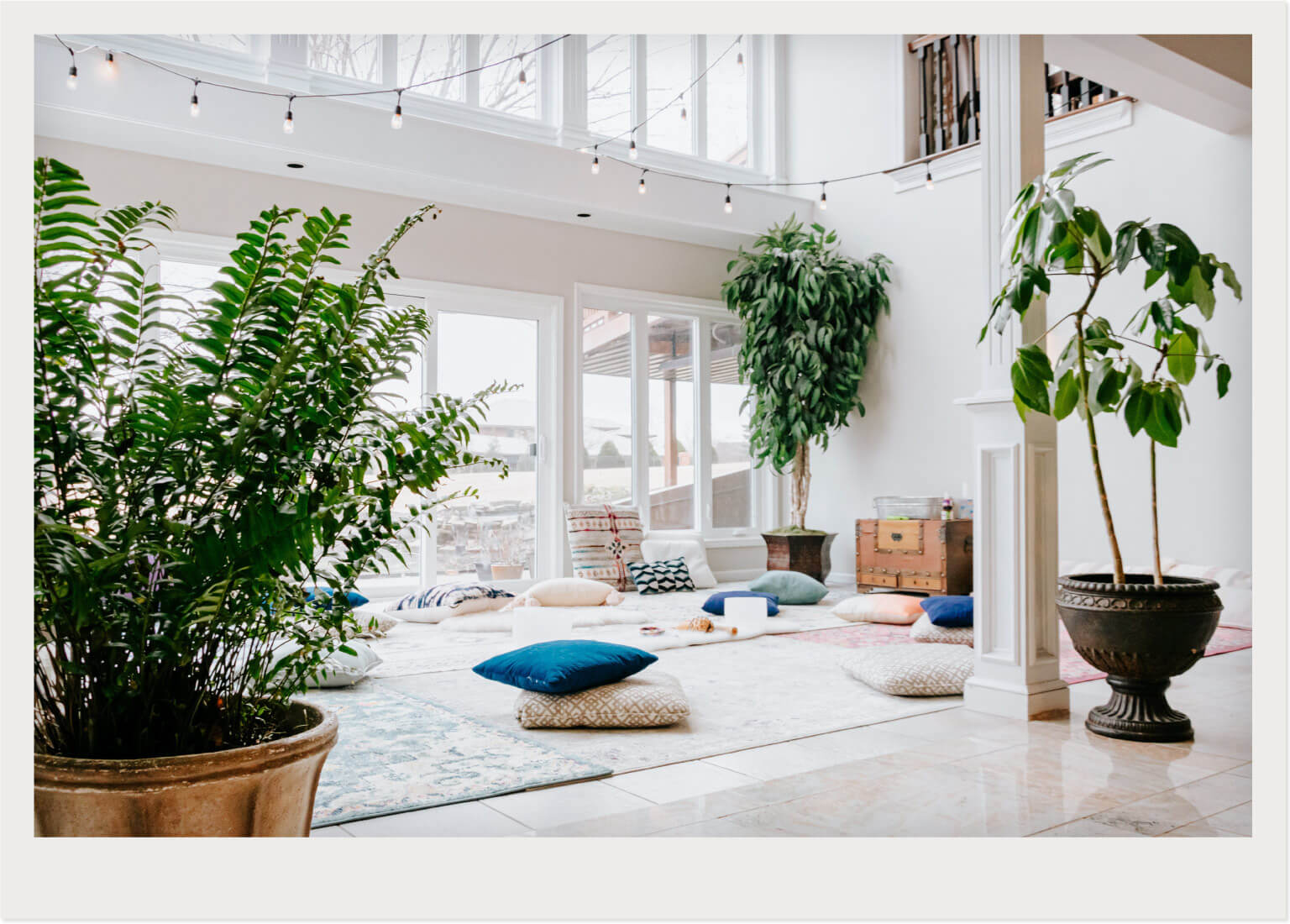 yoga and meditation space set up in sunroom