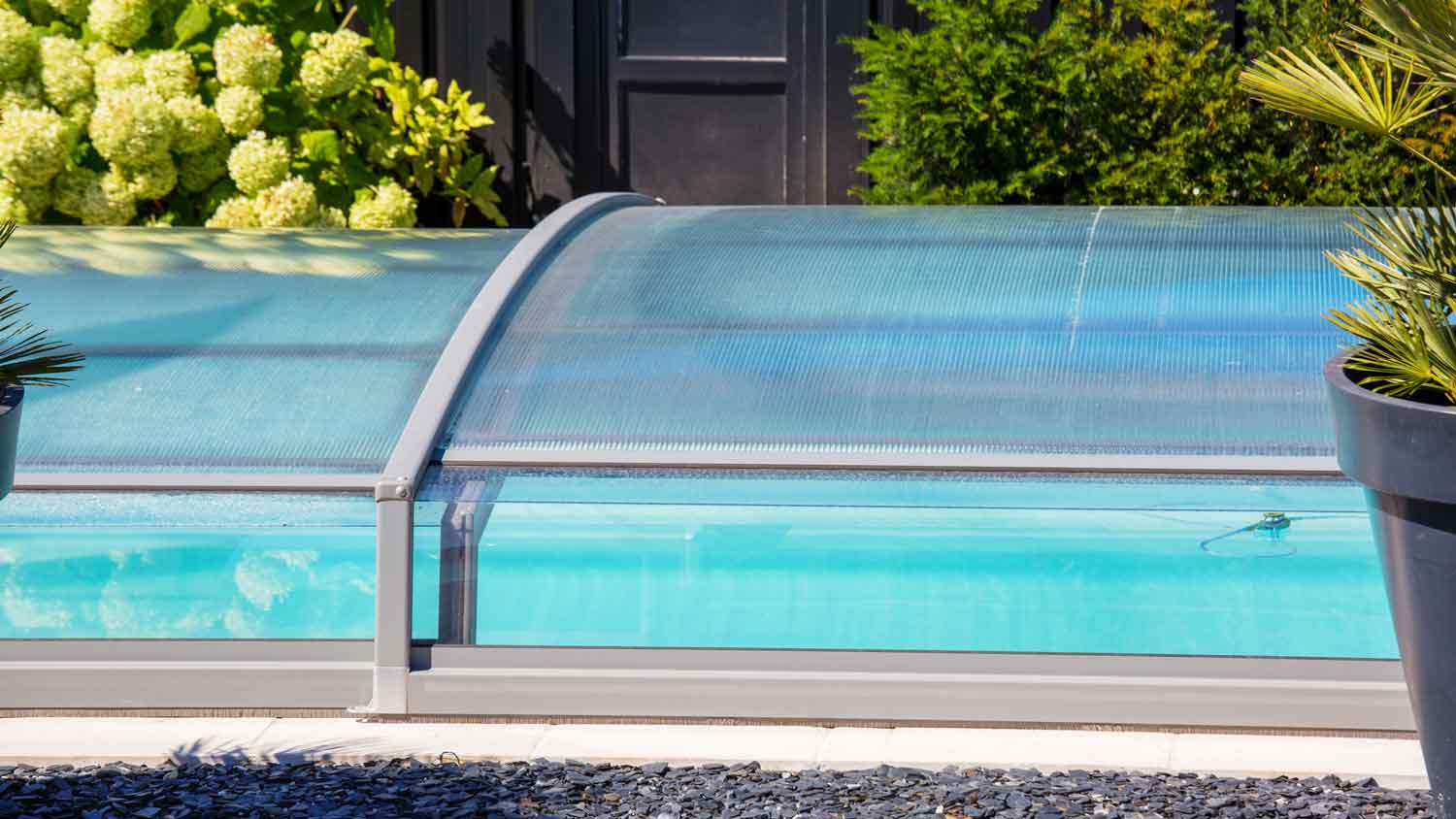 A retractable pool enclosure