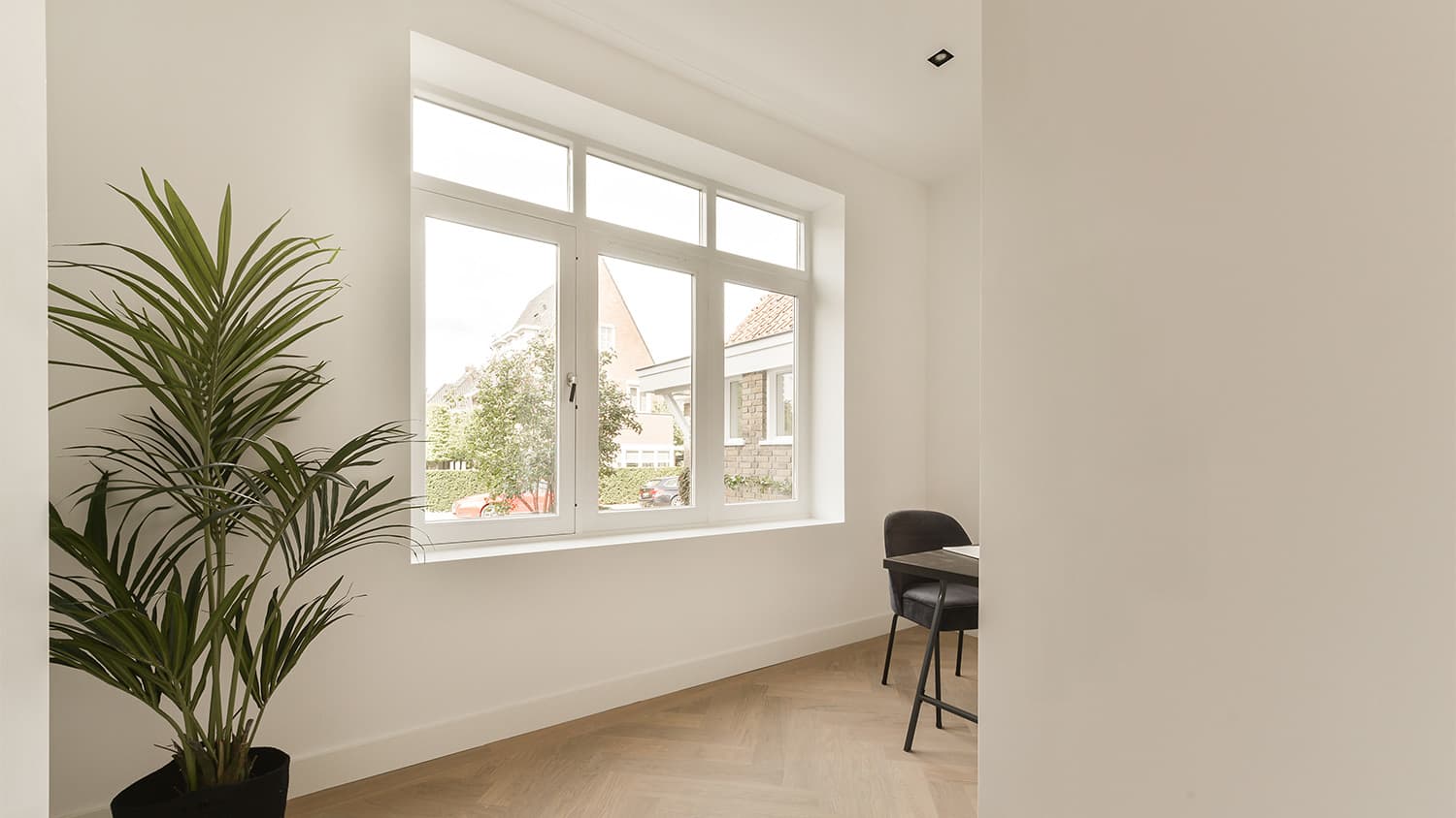 Young couple at window shopping for new house