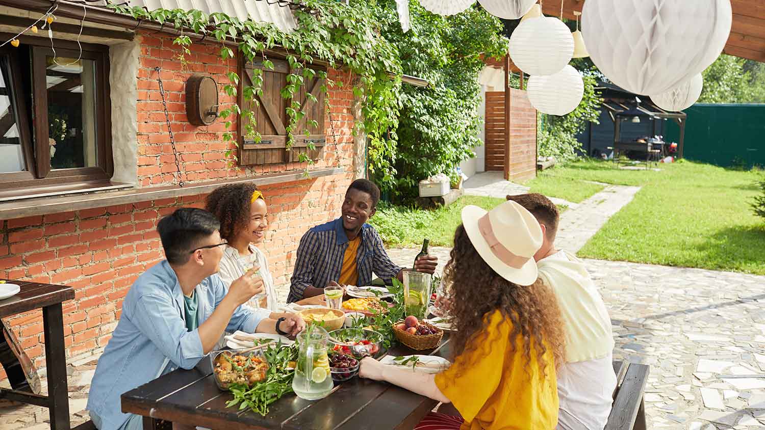 Group of friends having dinner on the patio