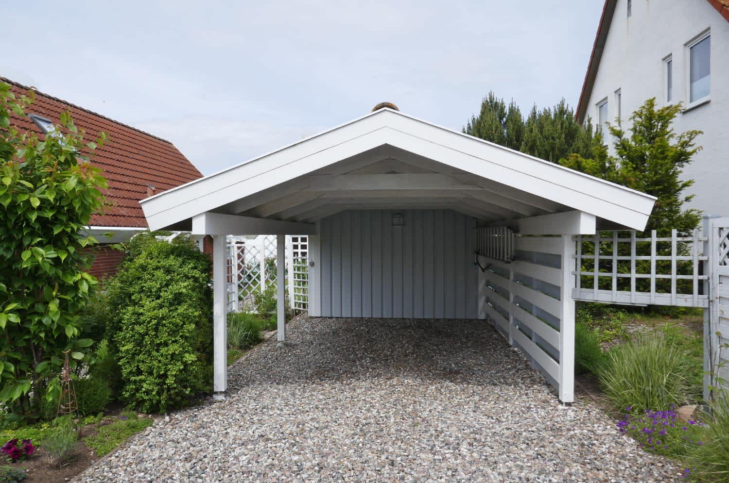 Wooden carport with pitched roof