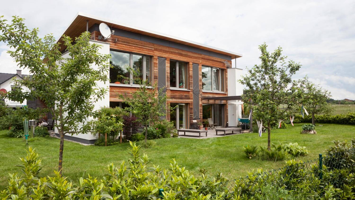 A backyard of a house with small trees
