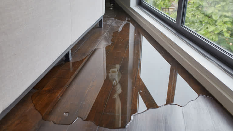 Water leaking onto hardwood floor
