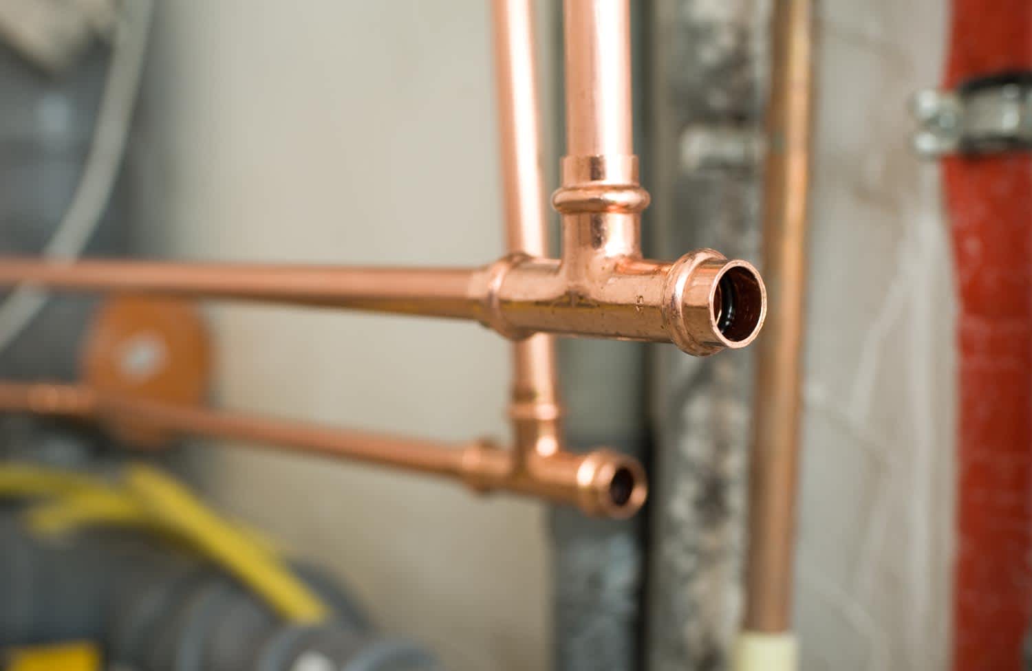 Close up of a installation of copper water pipes