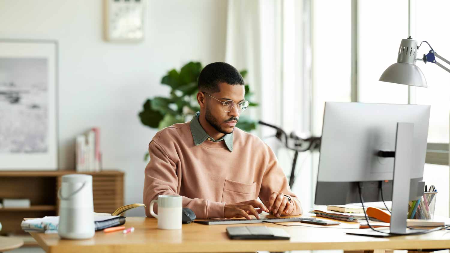 Man using desktop PC at desk
