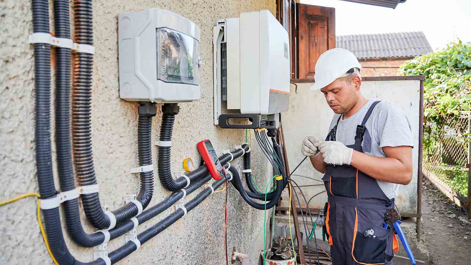 electrician doing maintenance on solar power system