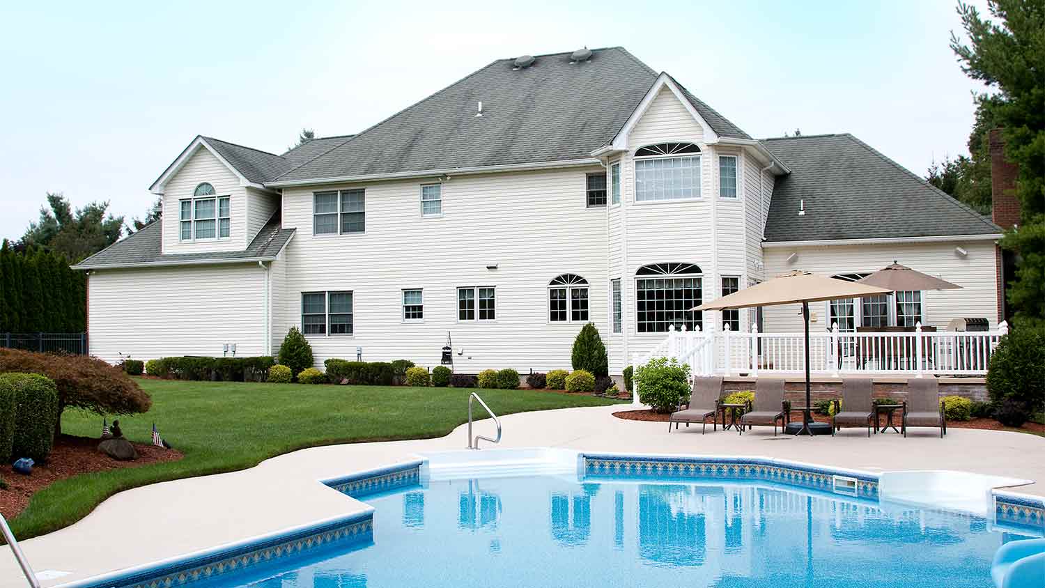 large house with pool in yard