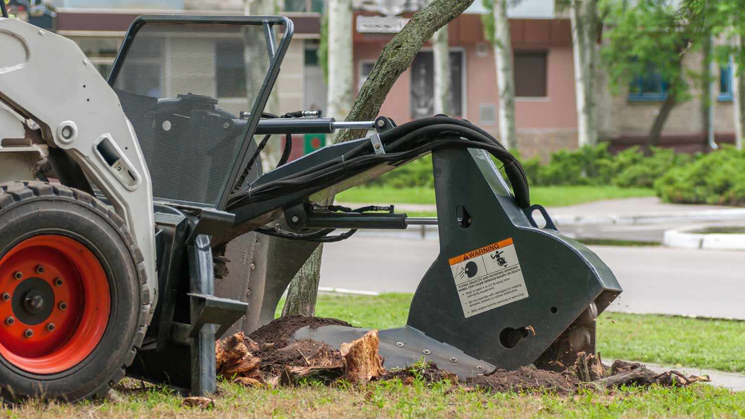 A machine removing a tree trunk
