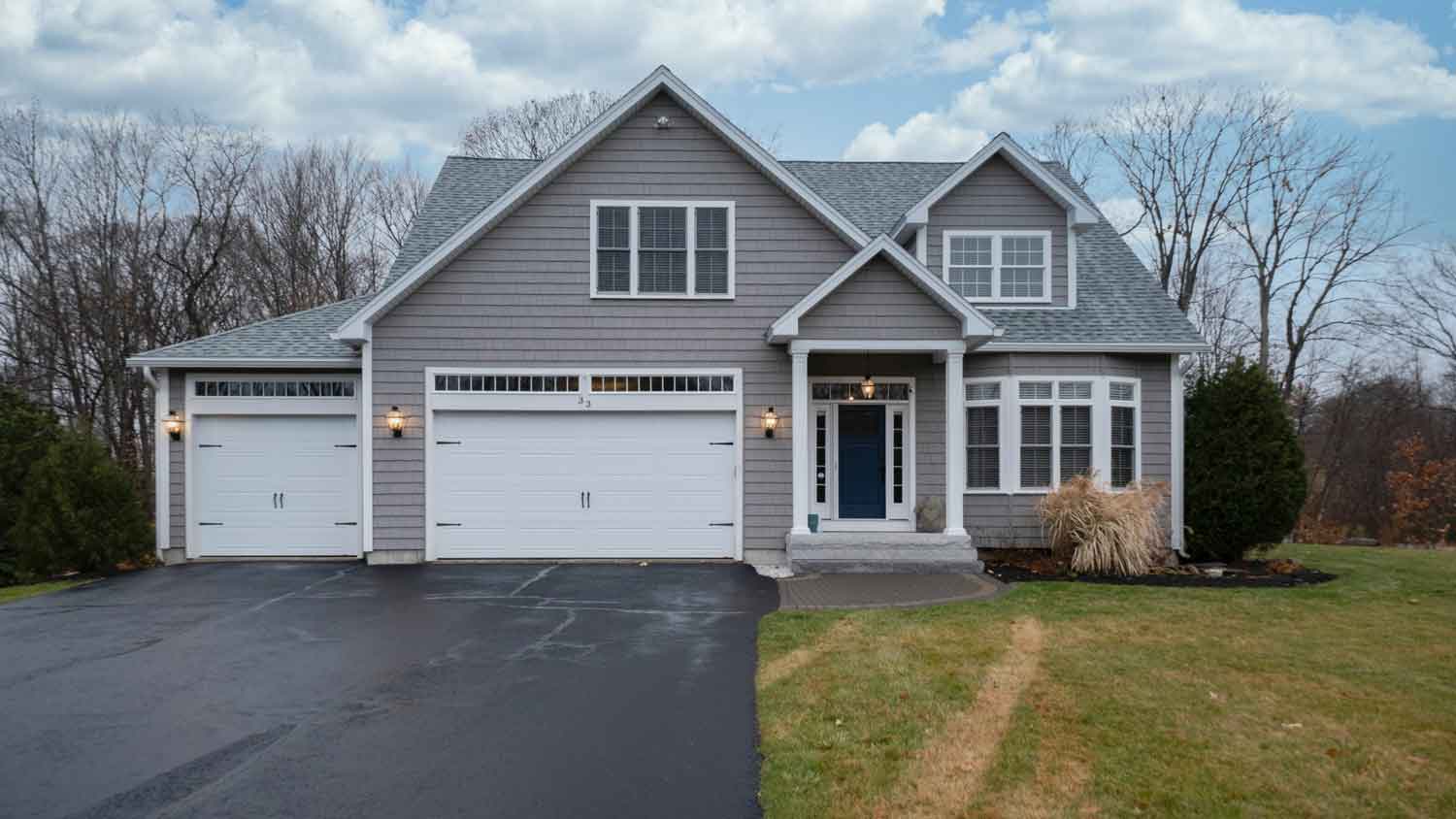 A house with freshly paved driveway