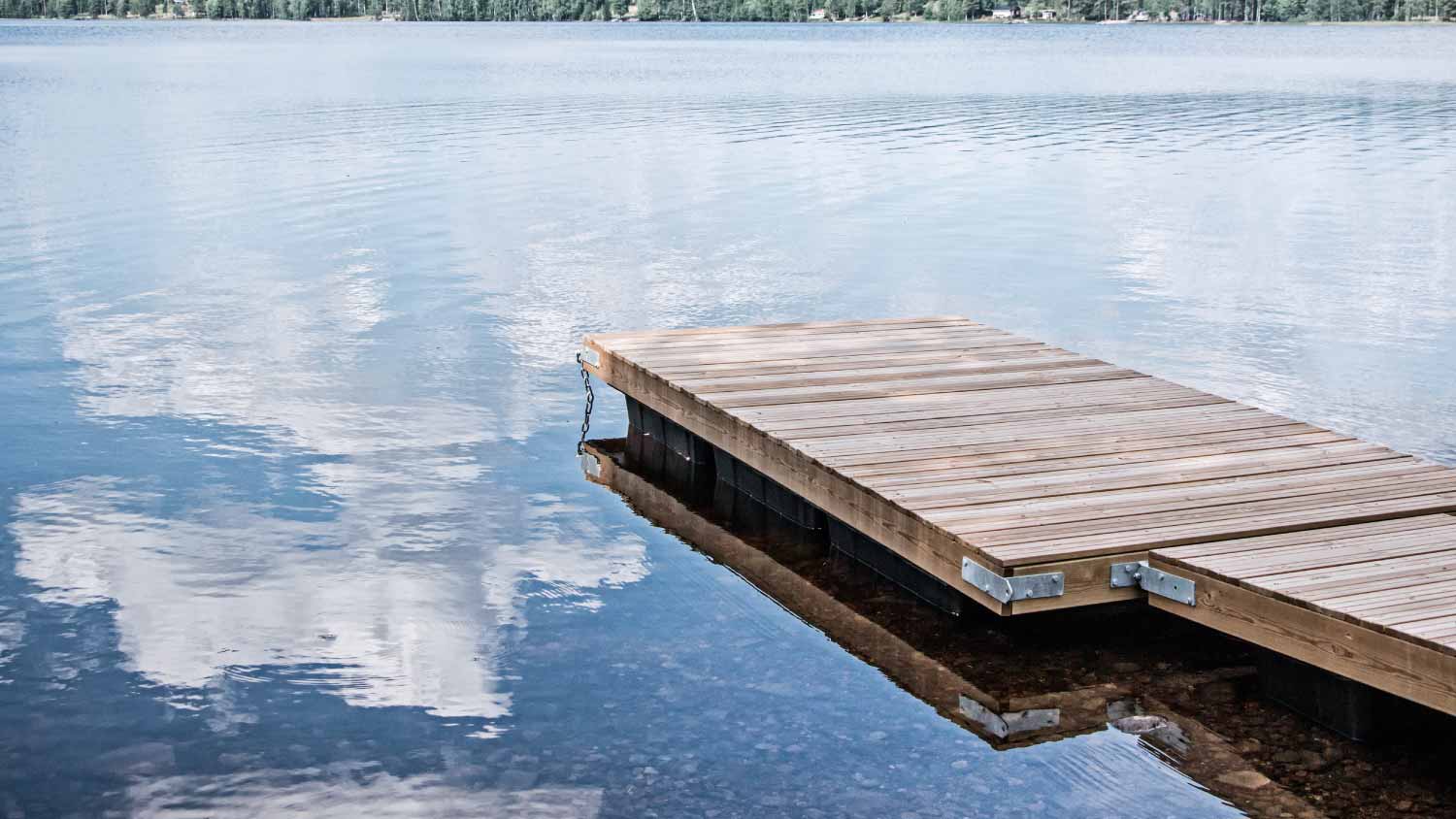 Wooden dock floating in lake