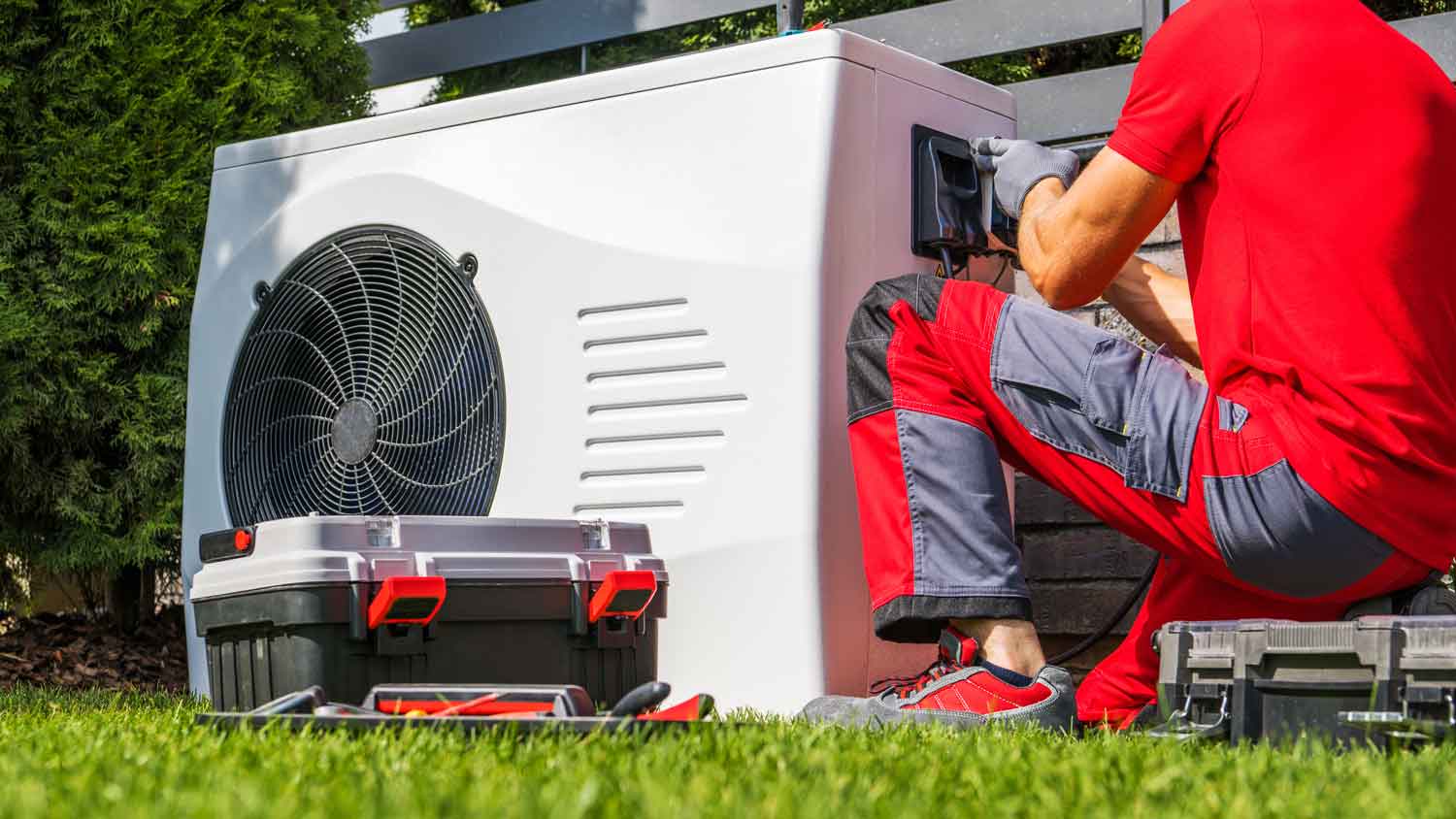 A professional repairing a pool heater