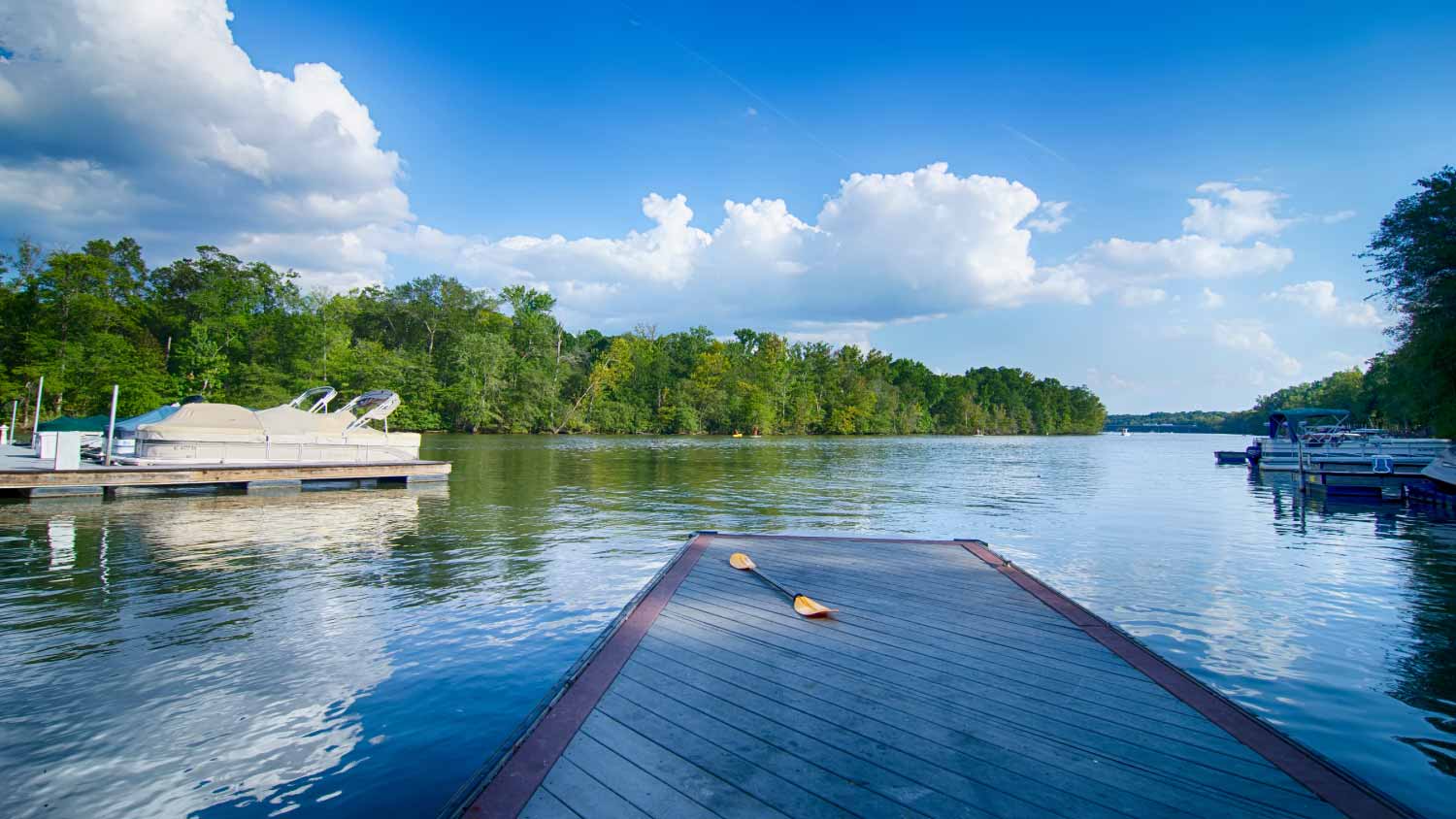 Dock on a lake with blue sky