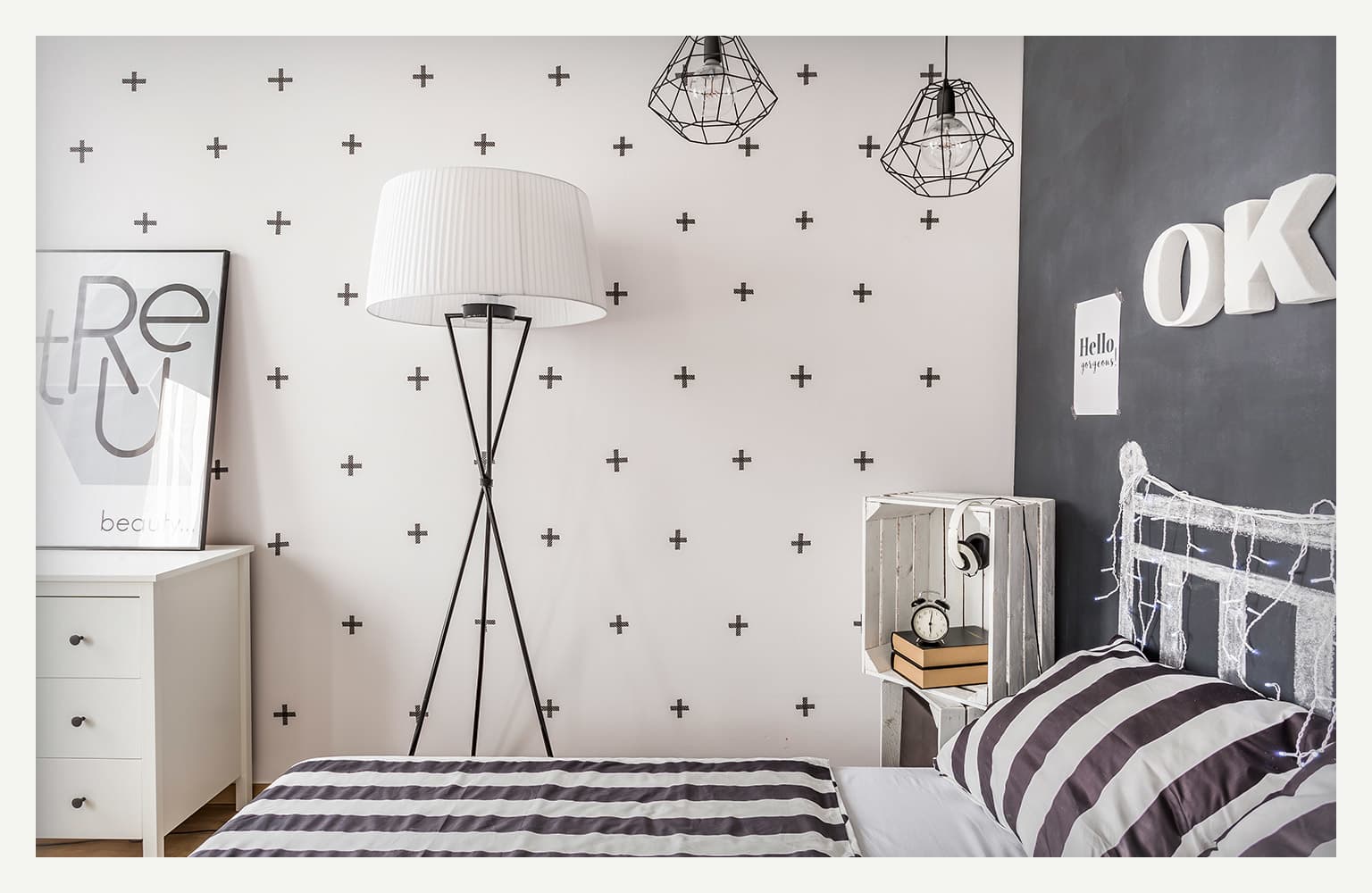 black plus signs patterned wall in bedroom
