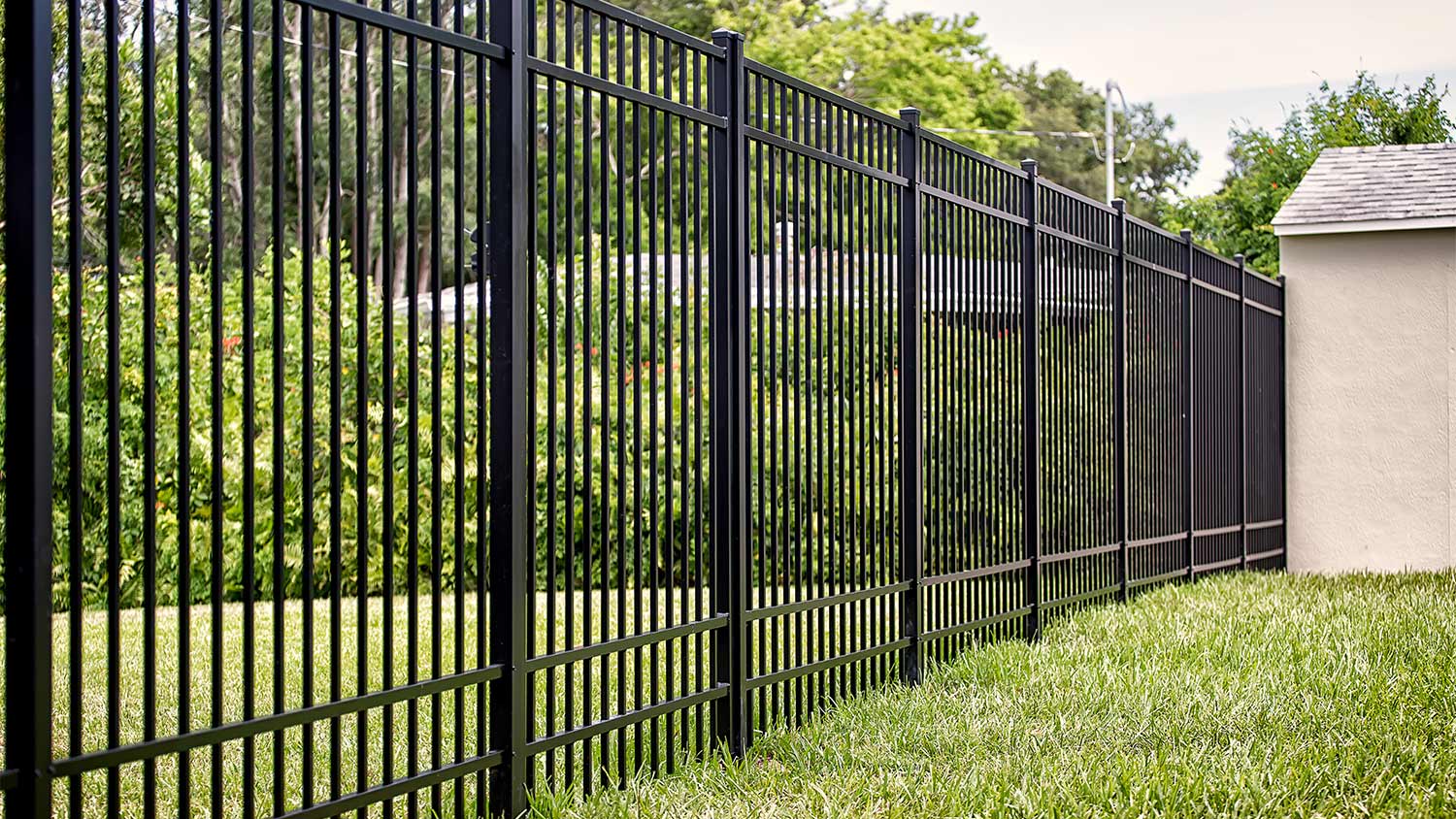 Black aluminum fence in yard