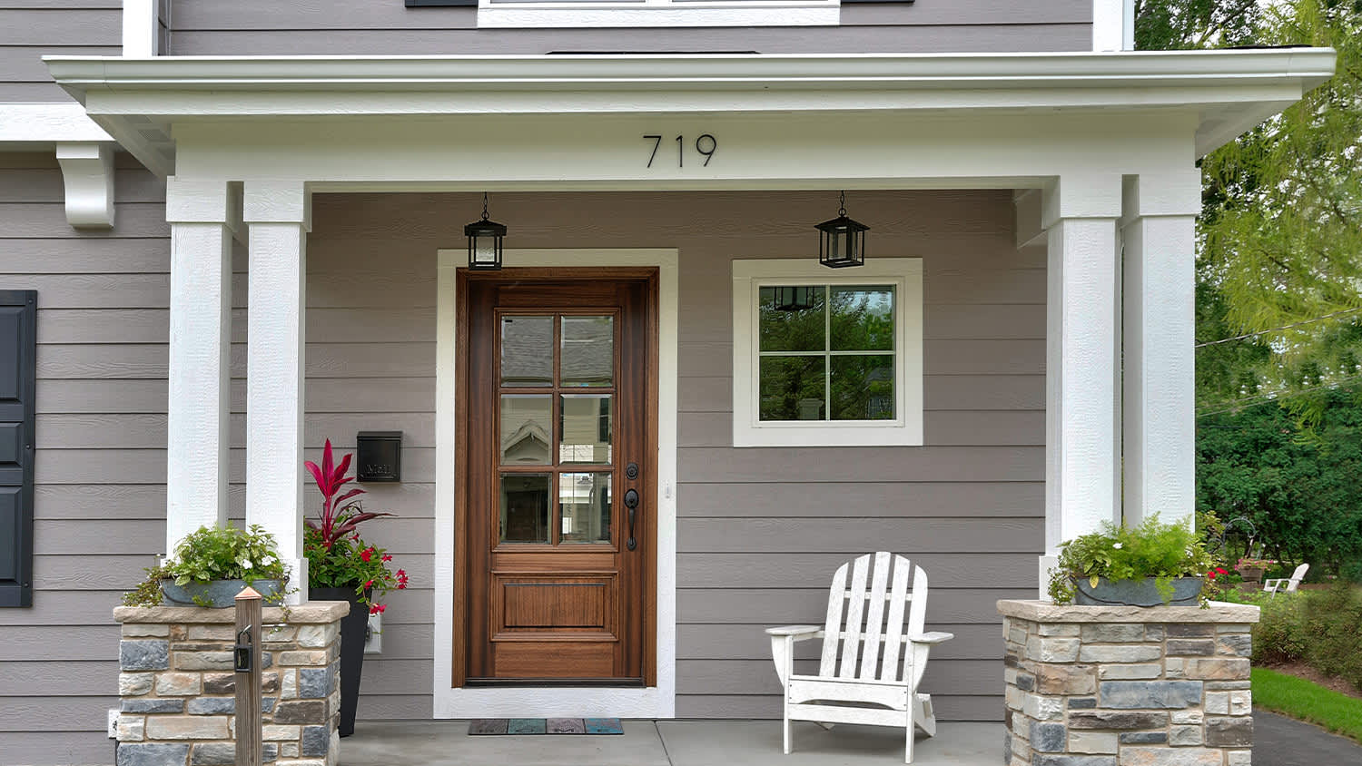 modern and minimal front porch and wood front door with glass windows