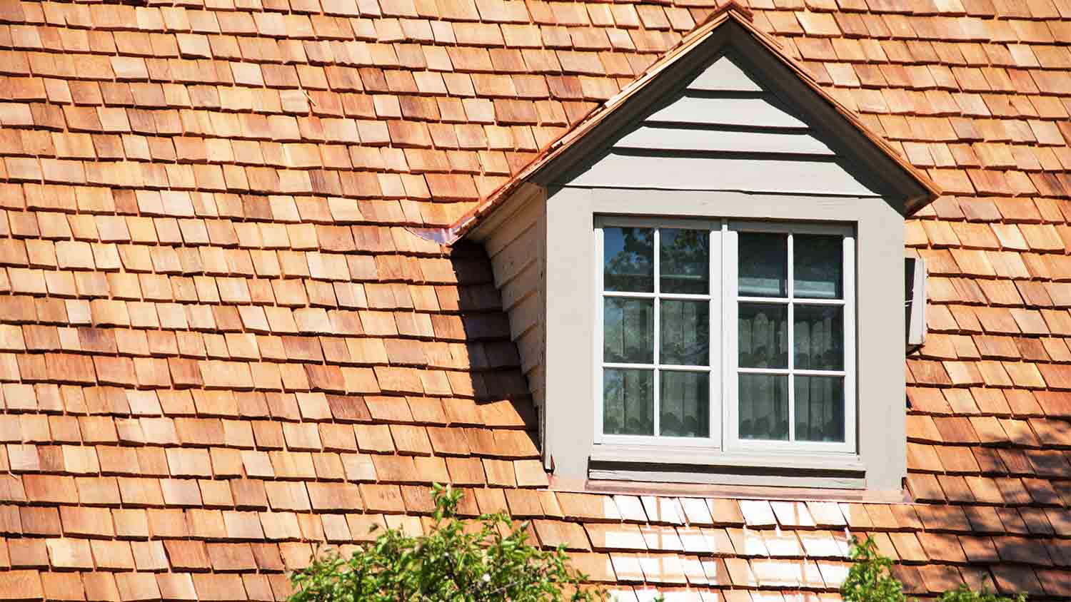 CEDAR SHINGLES ON ROOF OF HOUSE