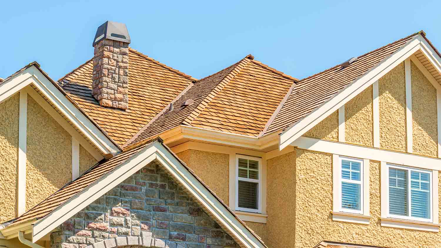 yellow home with wood shingles