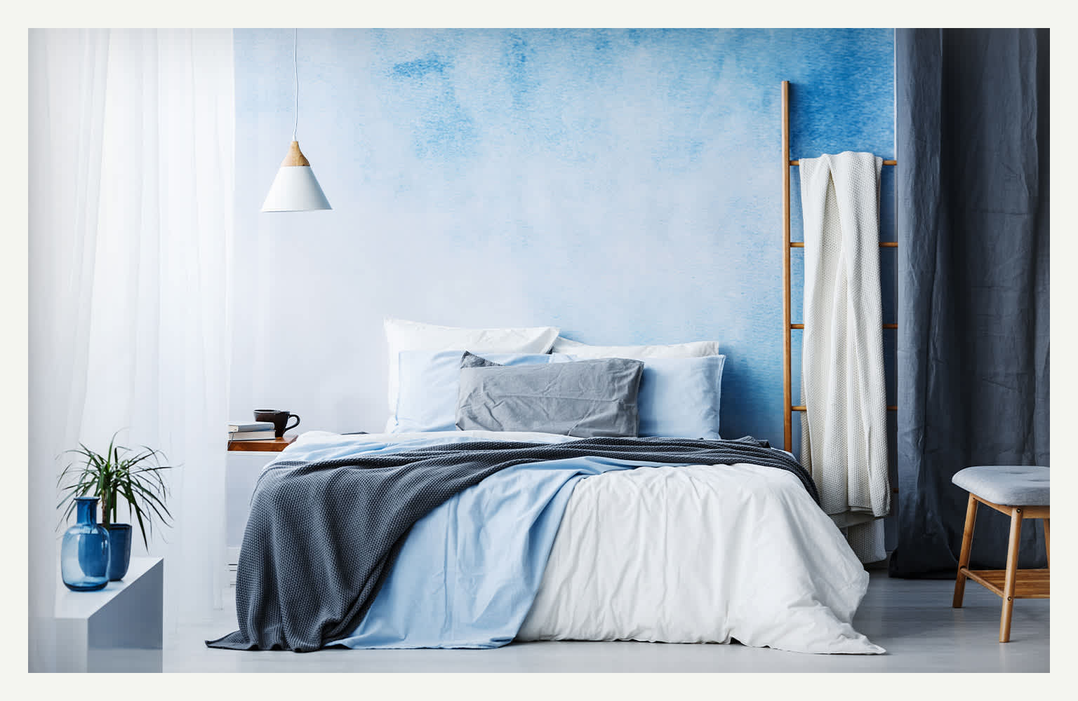 blue ombre painted wall in bedroom